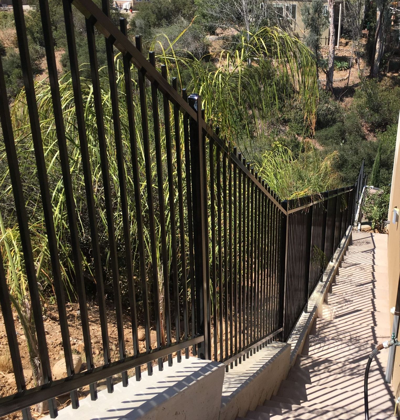 Ornamental iron fence on a hillside
